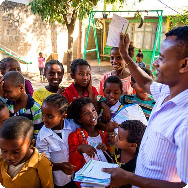 Man Teaching Children